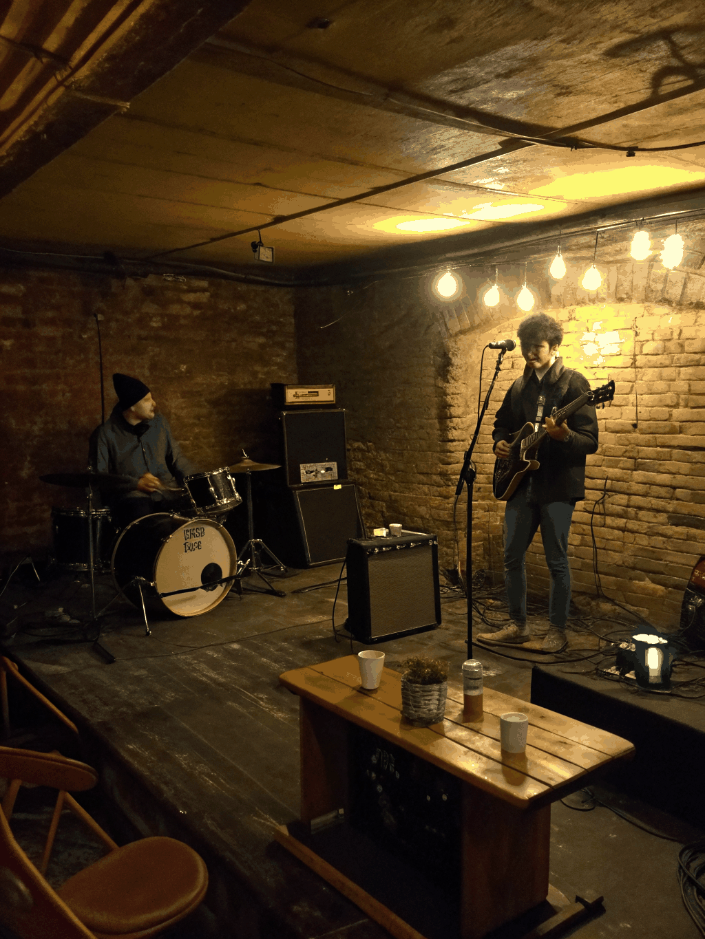 Intimate basement gig with packed crowd