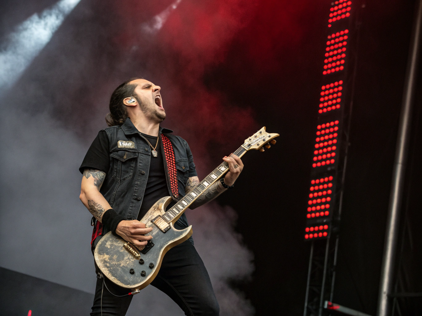 Punk guitarist shredding during intense live venue set