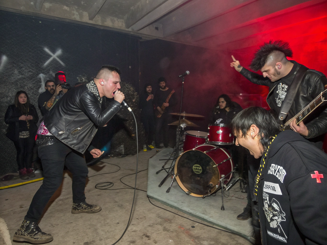 Punk vocalist shouting into microphone in high-contrast industrial light