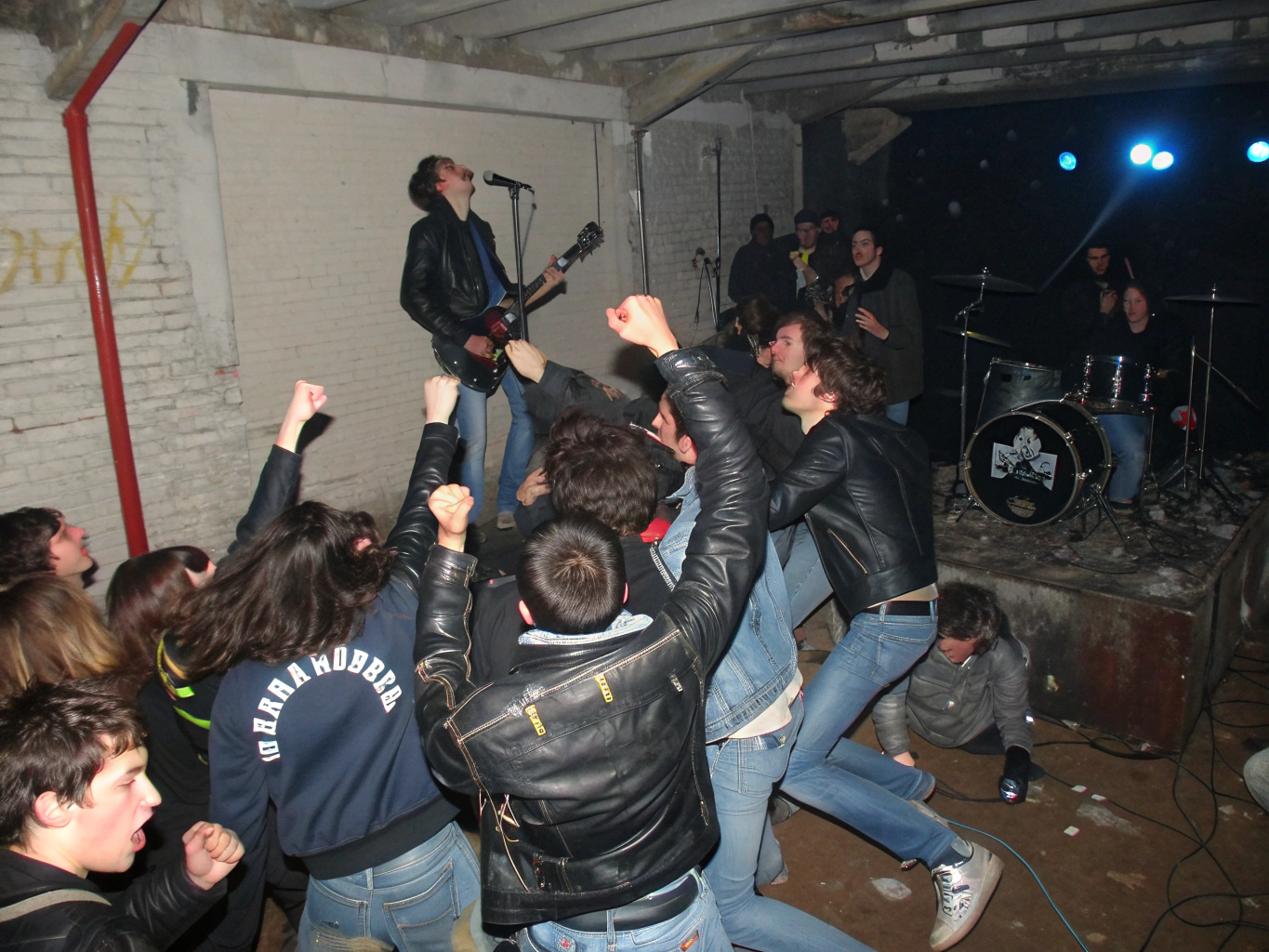 Underground punk gig in a raw basement stage setup